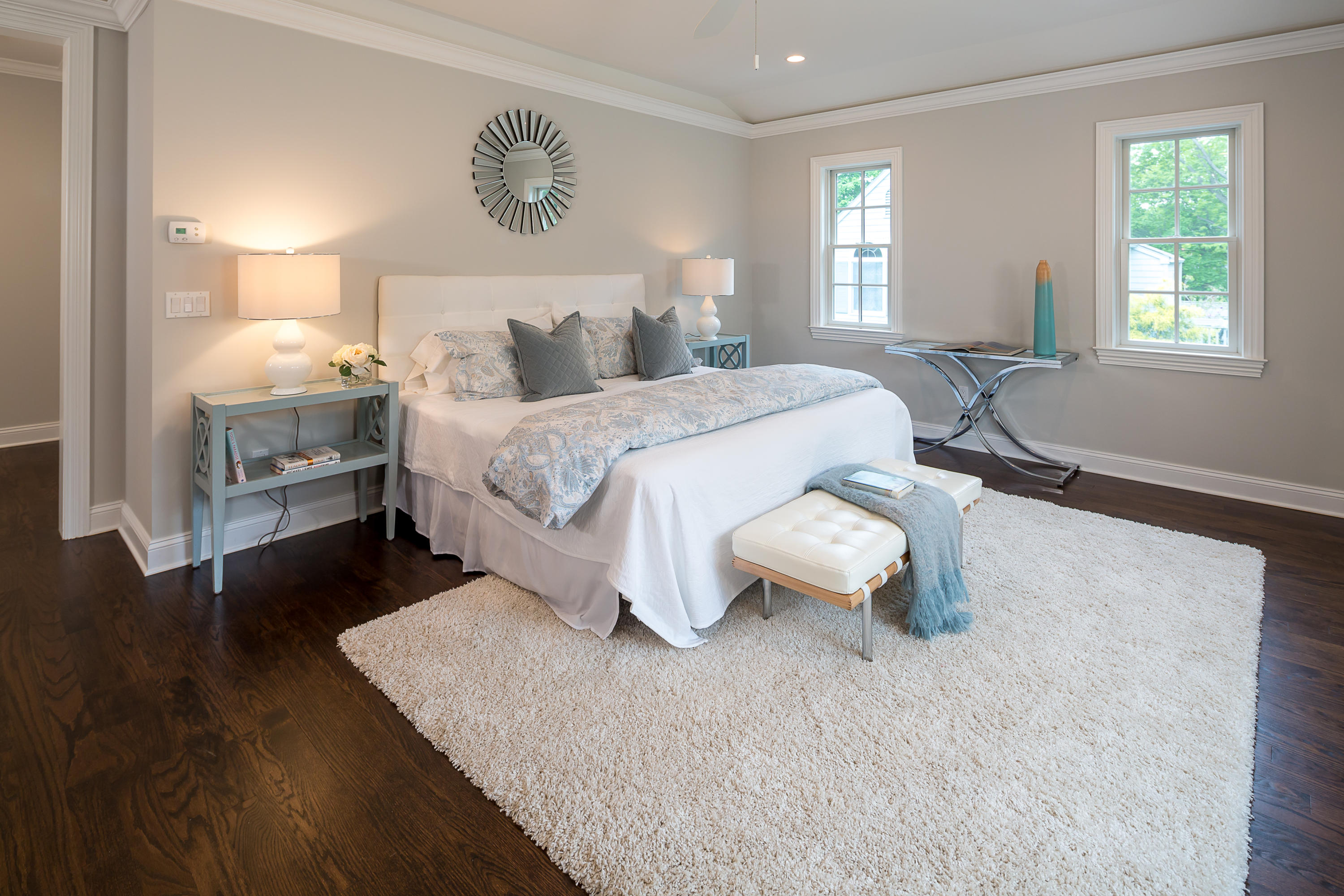 4 Echo Drive Darien, CT 06820 - Photo 22 of 40 a bedroom with a bed and wooden floor