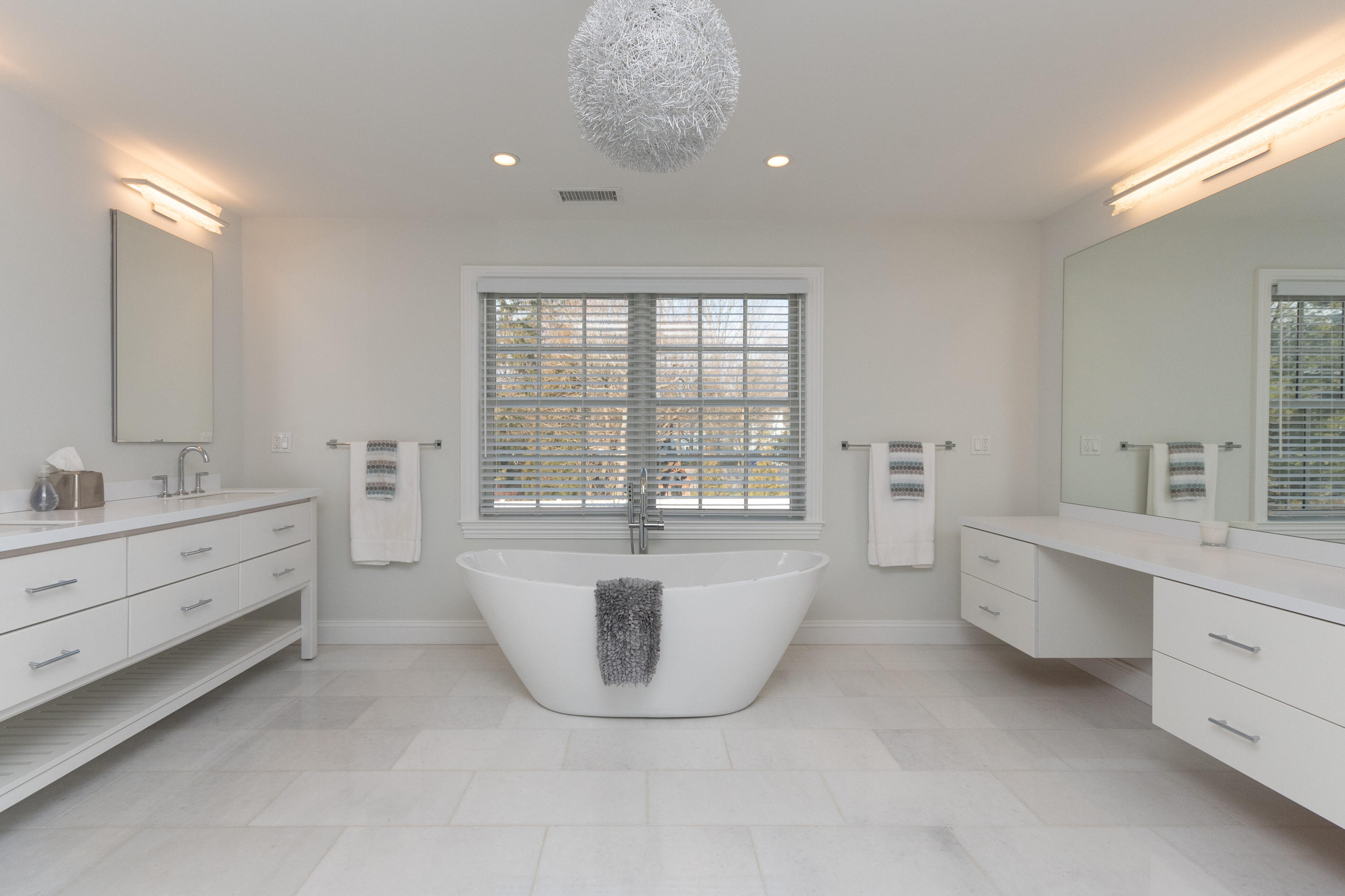 4 Echo Drive Darien, CT 06820 - Photo 24 of 40 a spacious bathroom with double vanity and a bathtub
