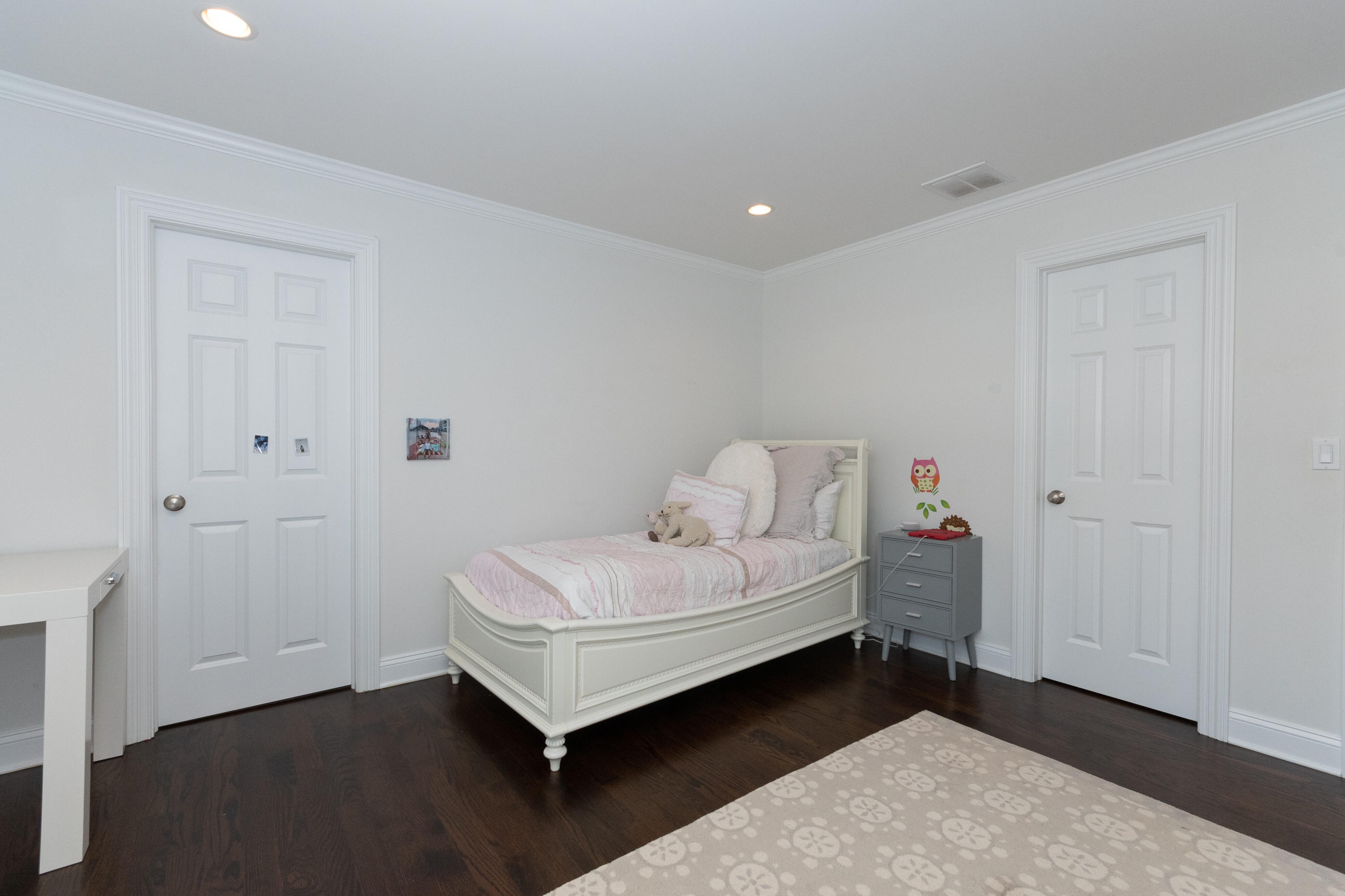 4 Echo Drive Darien, CT 06820 - Photo 30 of 40 a spacious bedroom with a bed and a window