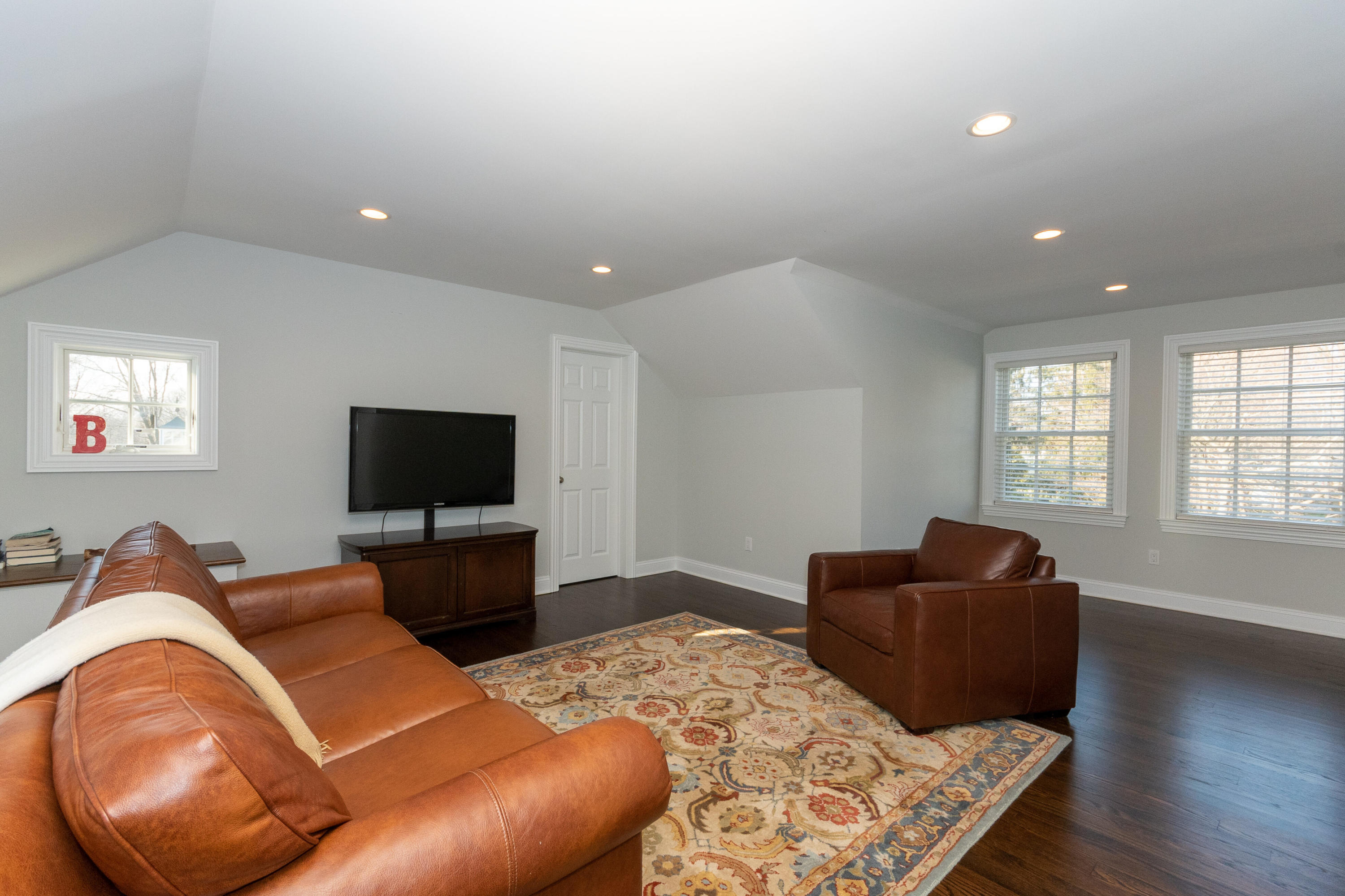 4 Echo Drive Darien, CT 06820 - Photo 34 of 40 a living room with furniture and a flat screen tv