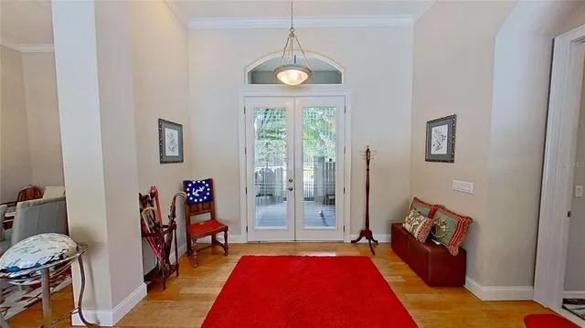 a bed room with a bed mirror and a window