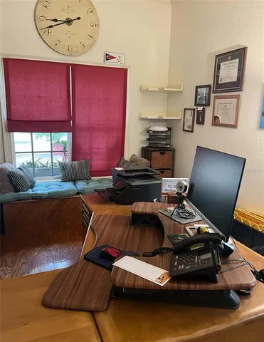 a bedroom with furniture and a window