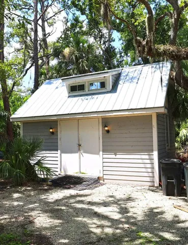 a side view of a house with a garage