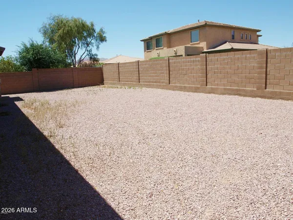 a view of white house with a snow on the road
