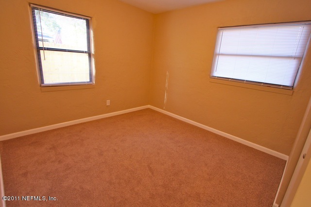 6764 Banbury Road Jacksonville, FL 32211 - Photo 11 of 17 an empty room with a window