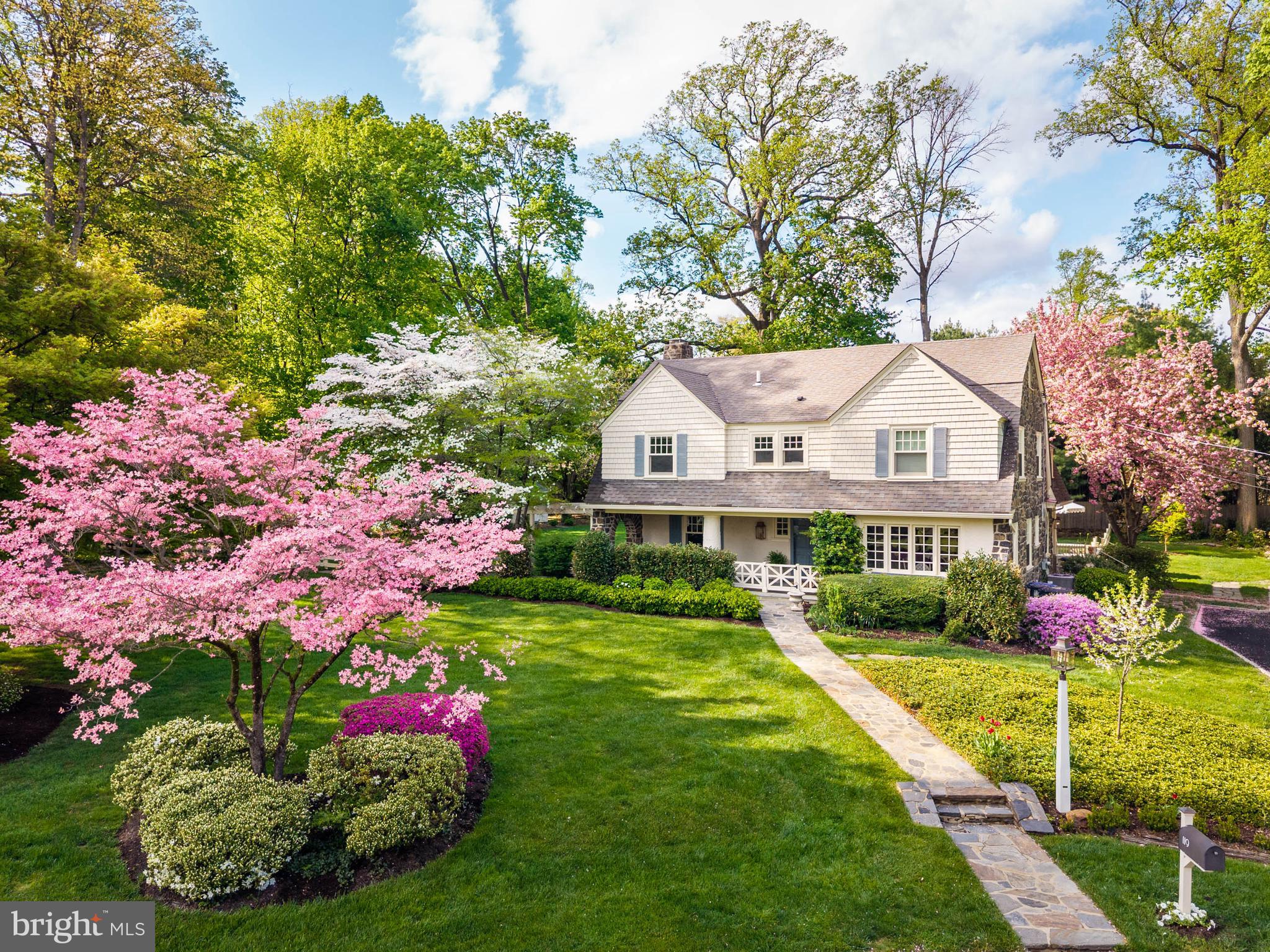 119 Cambria Court Wayne, PA 19087 - Photo 1 of 52 a view of house with garden and flowers