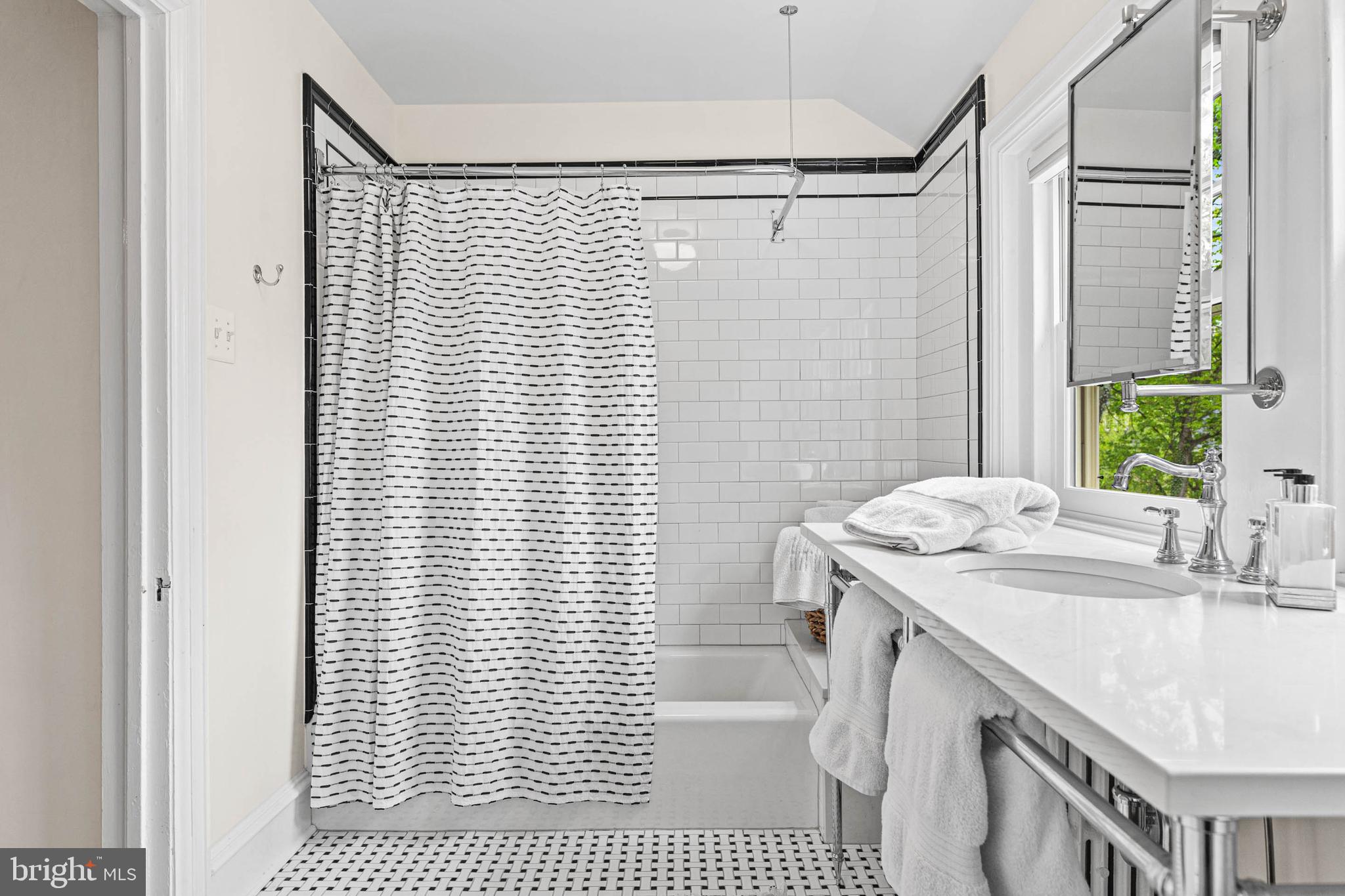 119 Cambria Court Wayne, PA 19087 - Photo 36 of 52 a bathroom with a sink a toilet a mirror and shower