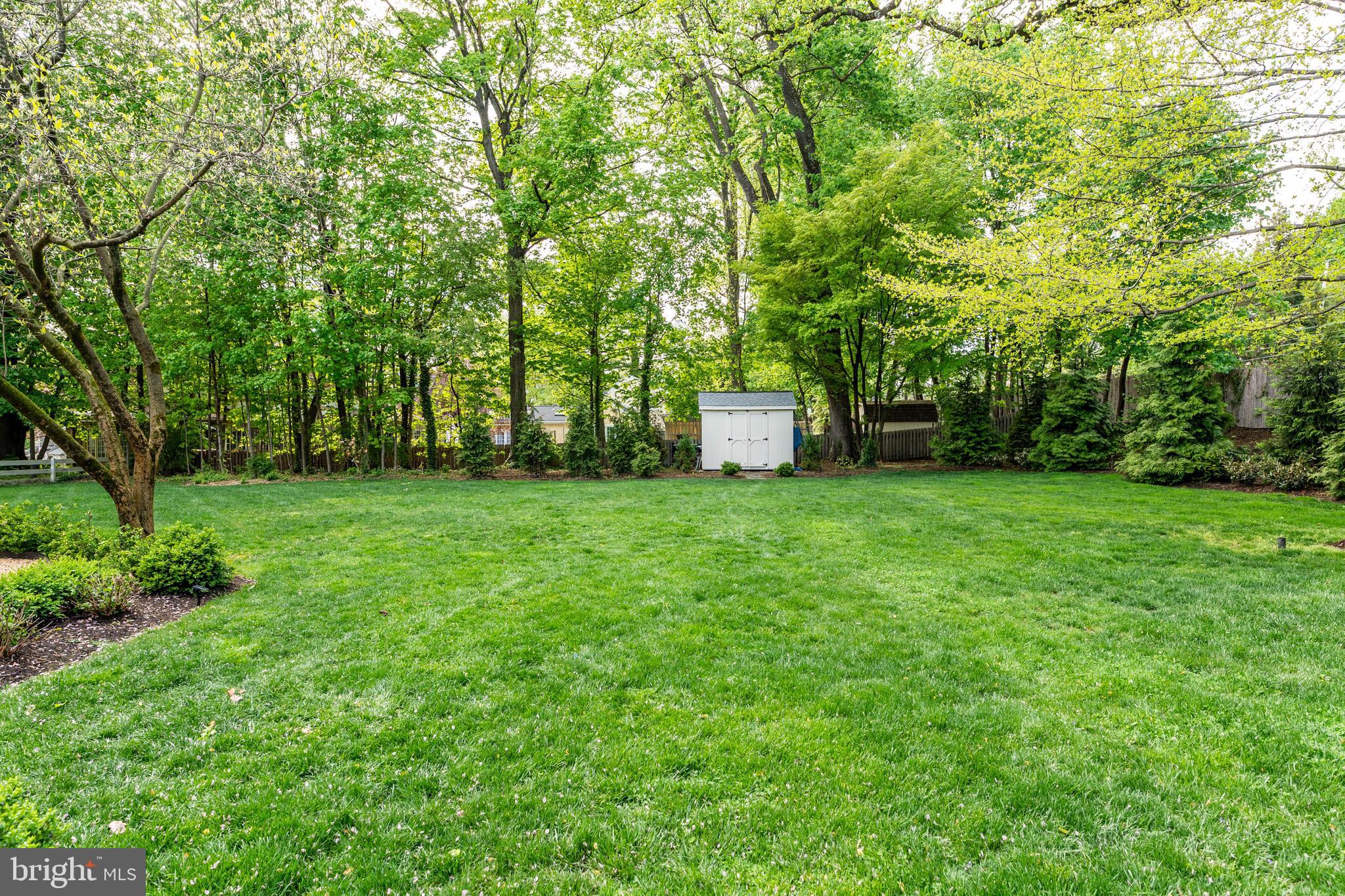 119 Cambria Court Wayne, PA 19087 - Photo 45 of 52 a view of a backyard with large trees