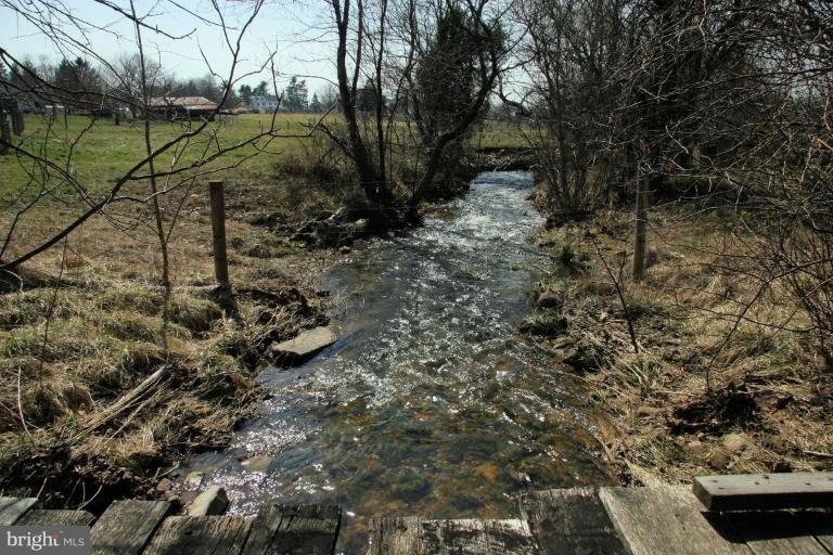 22544 Cavetown Church Road Cavetown, MD 21783 - Photo 16 of 18 Year-round stream on property.