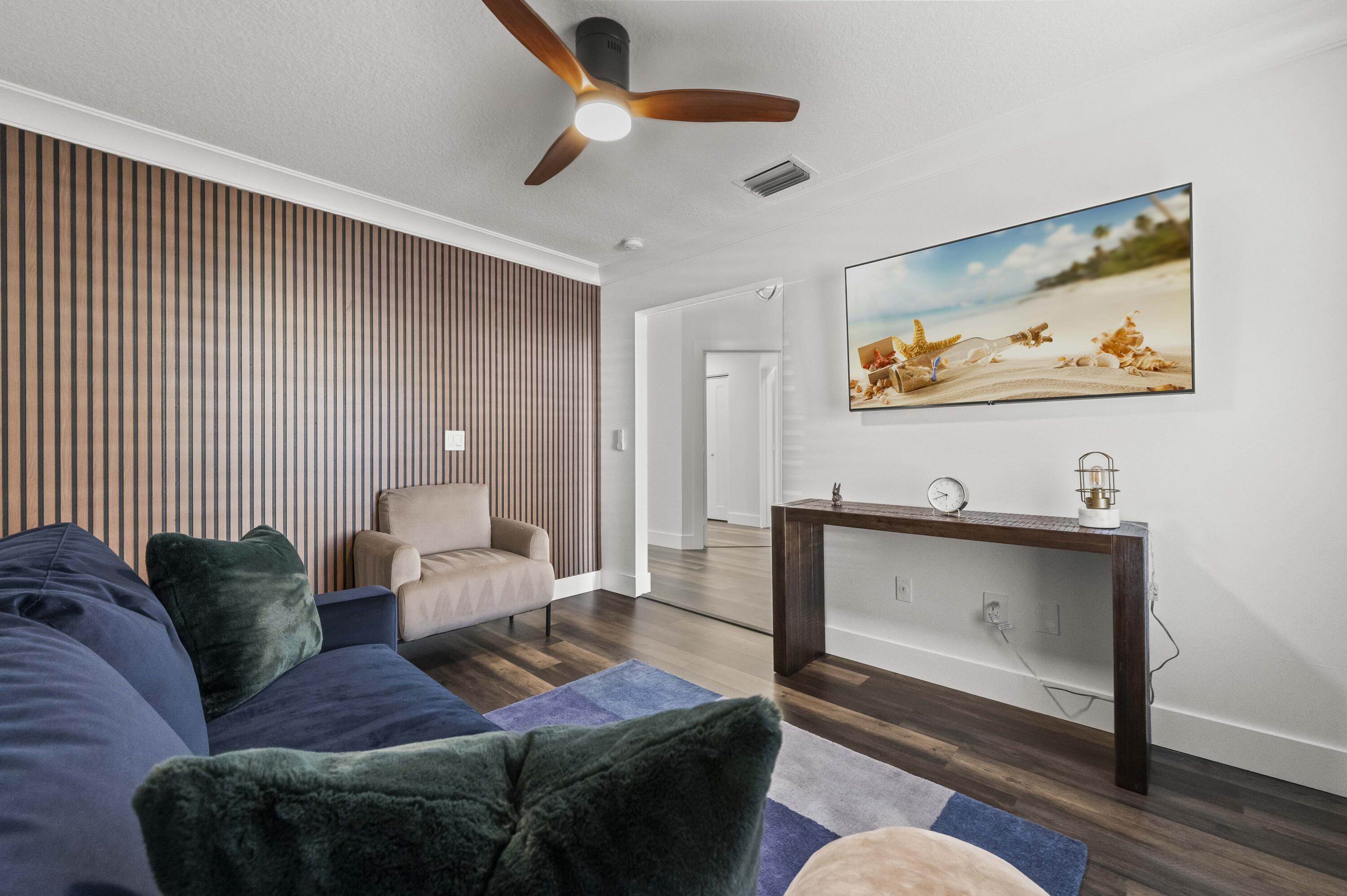 17257 Boca Club Boulevard, Unit 4 Boca Raton, FL 33487 - Photo 17 of 35 a living room with furniture and a ceiling fan