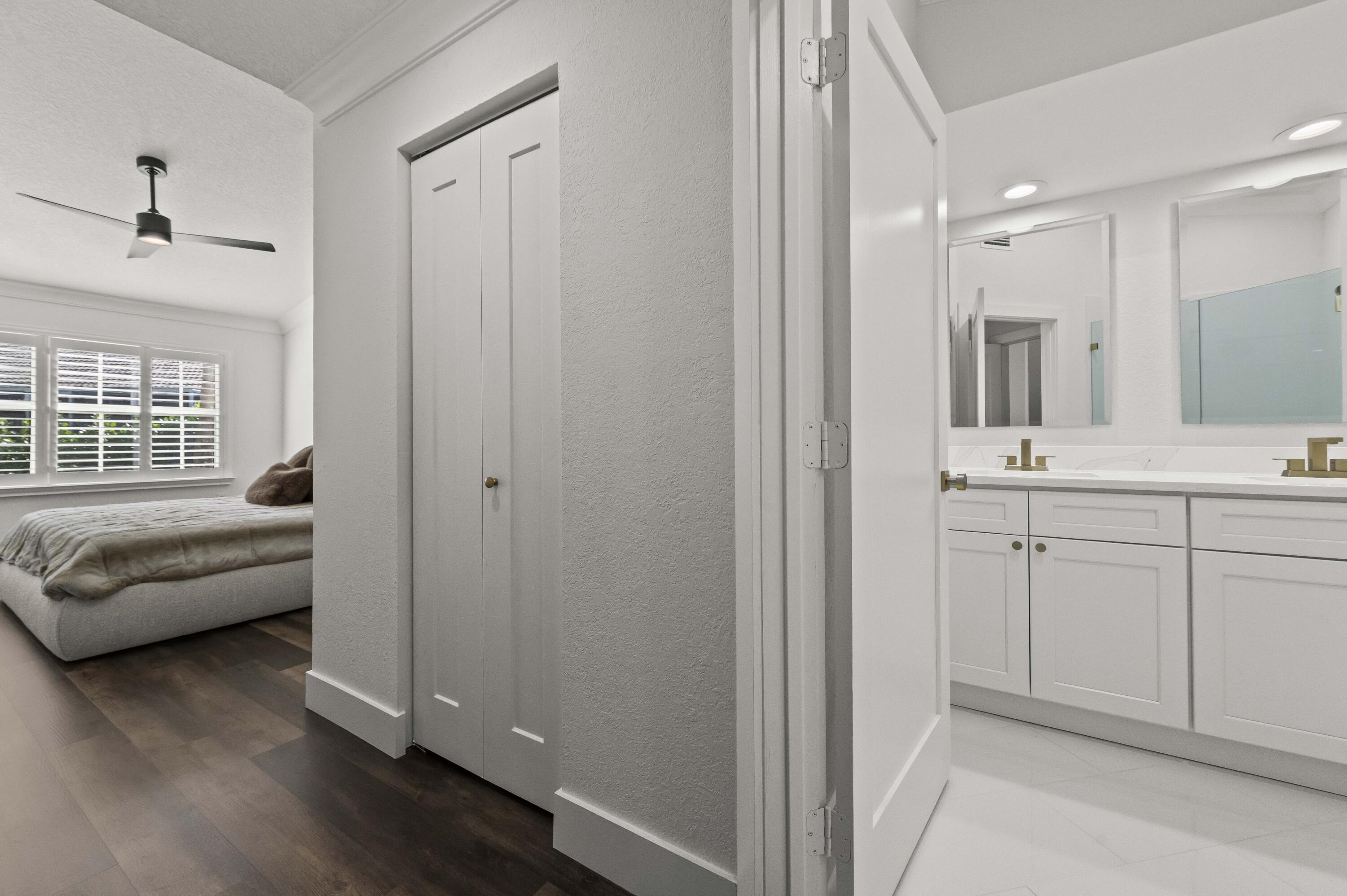 17257 Boca Club Boulevard, Unit 4 Boca Raton, FL 33487 - Photo 18 of 35 a bathroom with a sink and a mirror