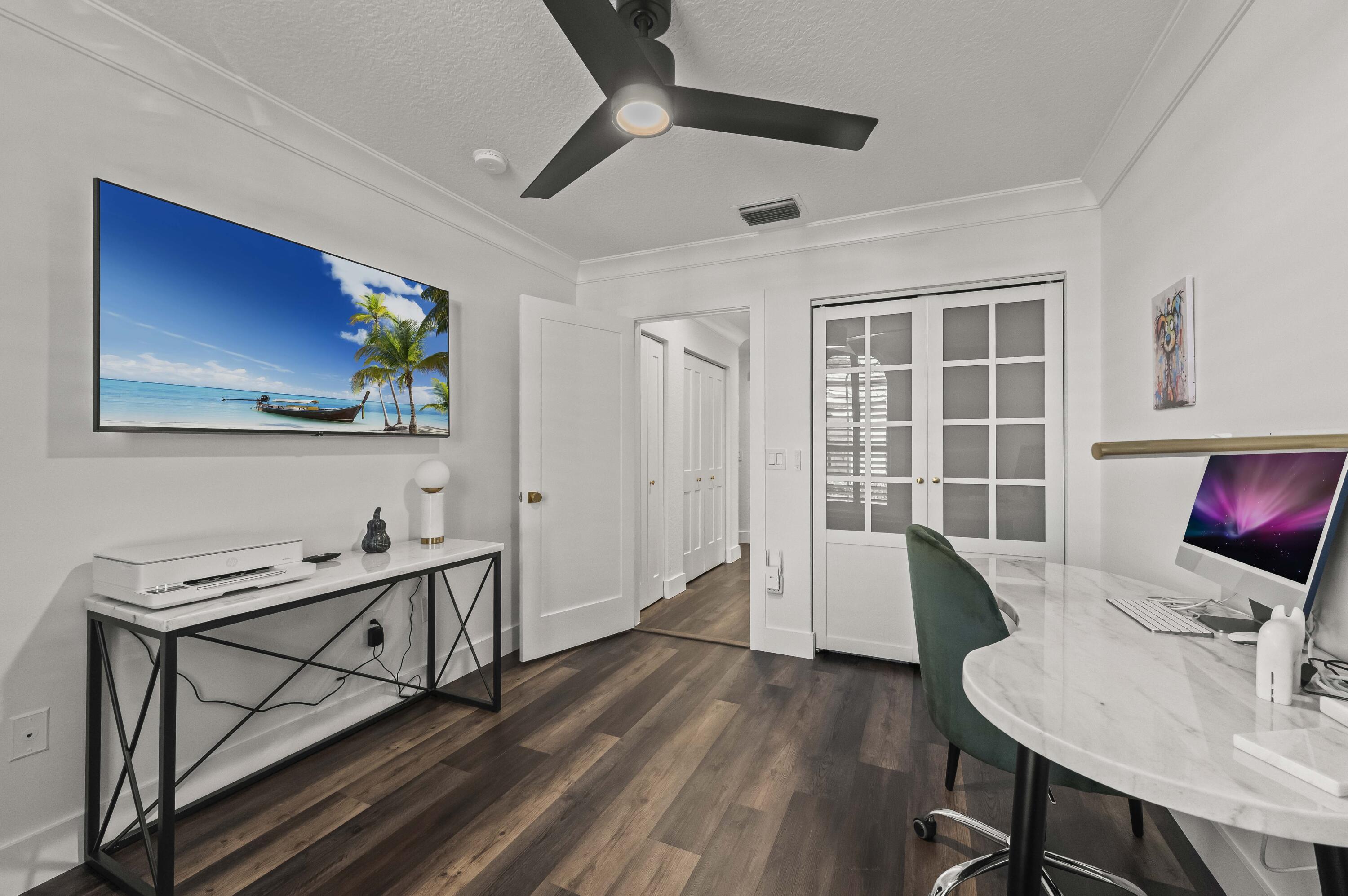 17257 Boca Club Boulevard, Unit 4 Boca Raton, FL 33487 - Photo 25 of 35 a view of a workspace with furniture and a window