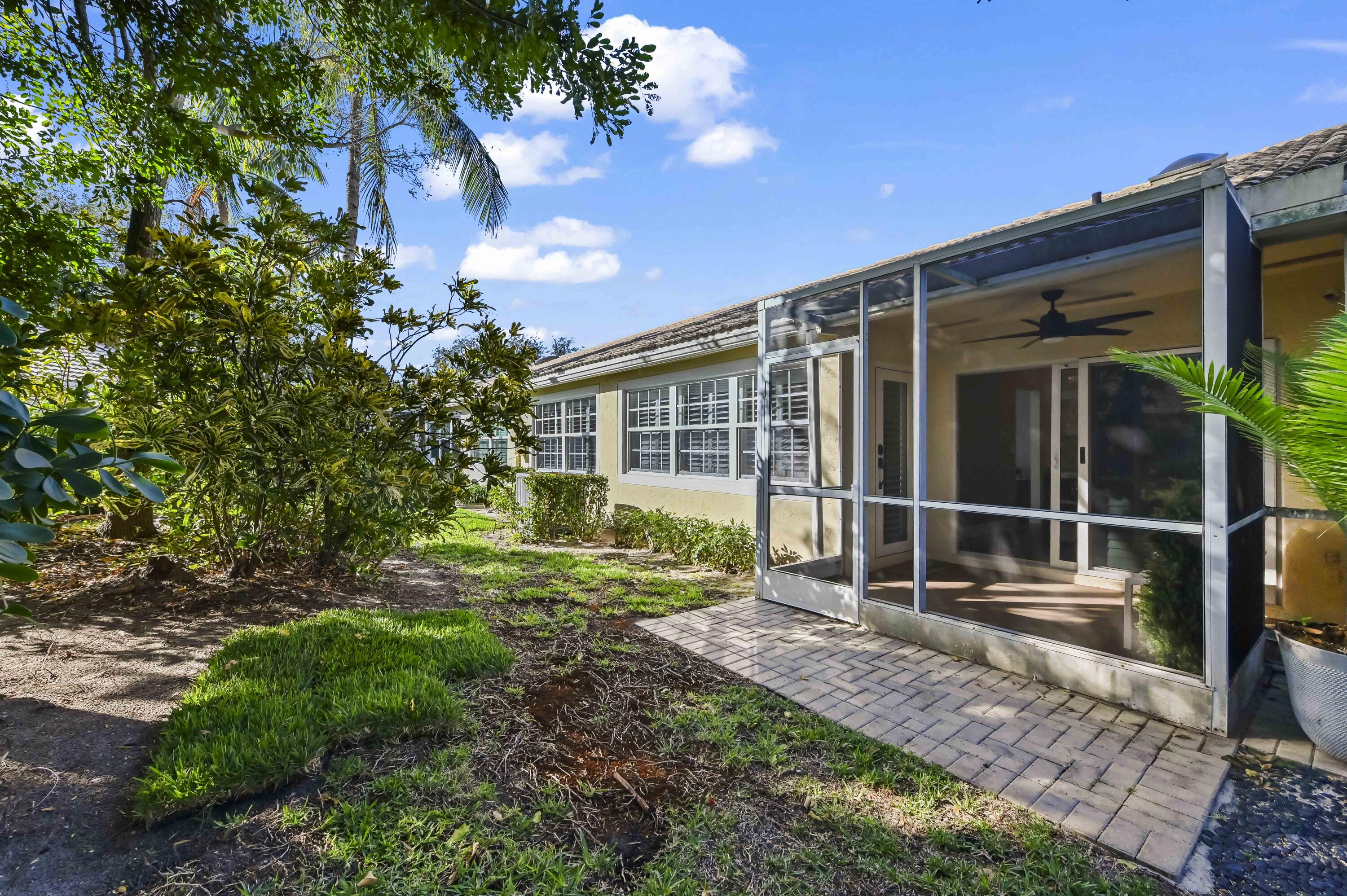 17257 Boca Club Boulevard, Unit 4 Boca Raton, FL 33487 - Photo 31 of 35 a house view with a backyard space