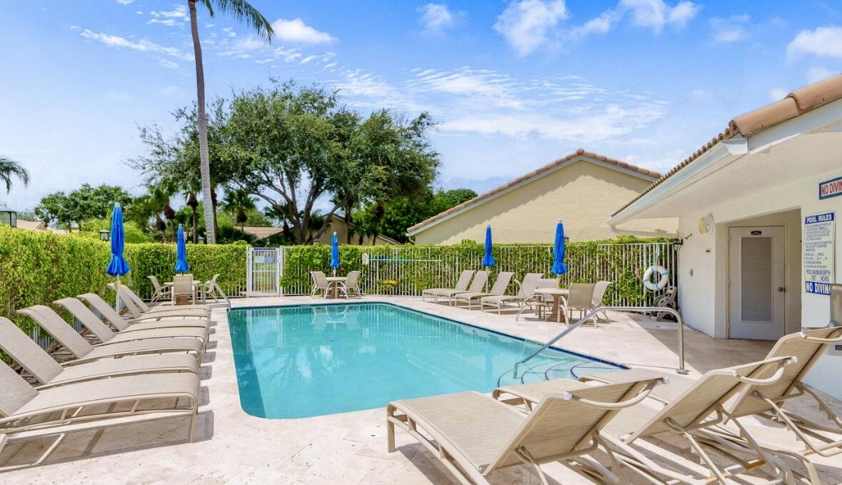 17257 Boca Club Boulevard, Unit 4 Boca Raton, FL 33487 - Photo 34 of 35 a view of a patio with swimming pool