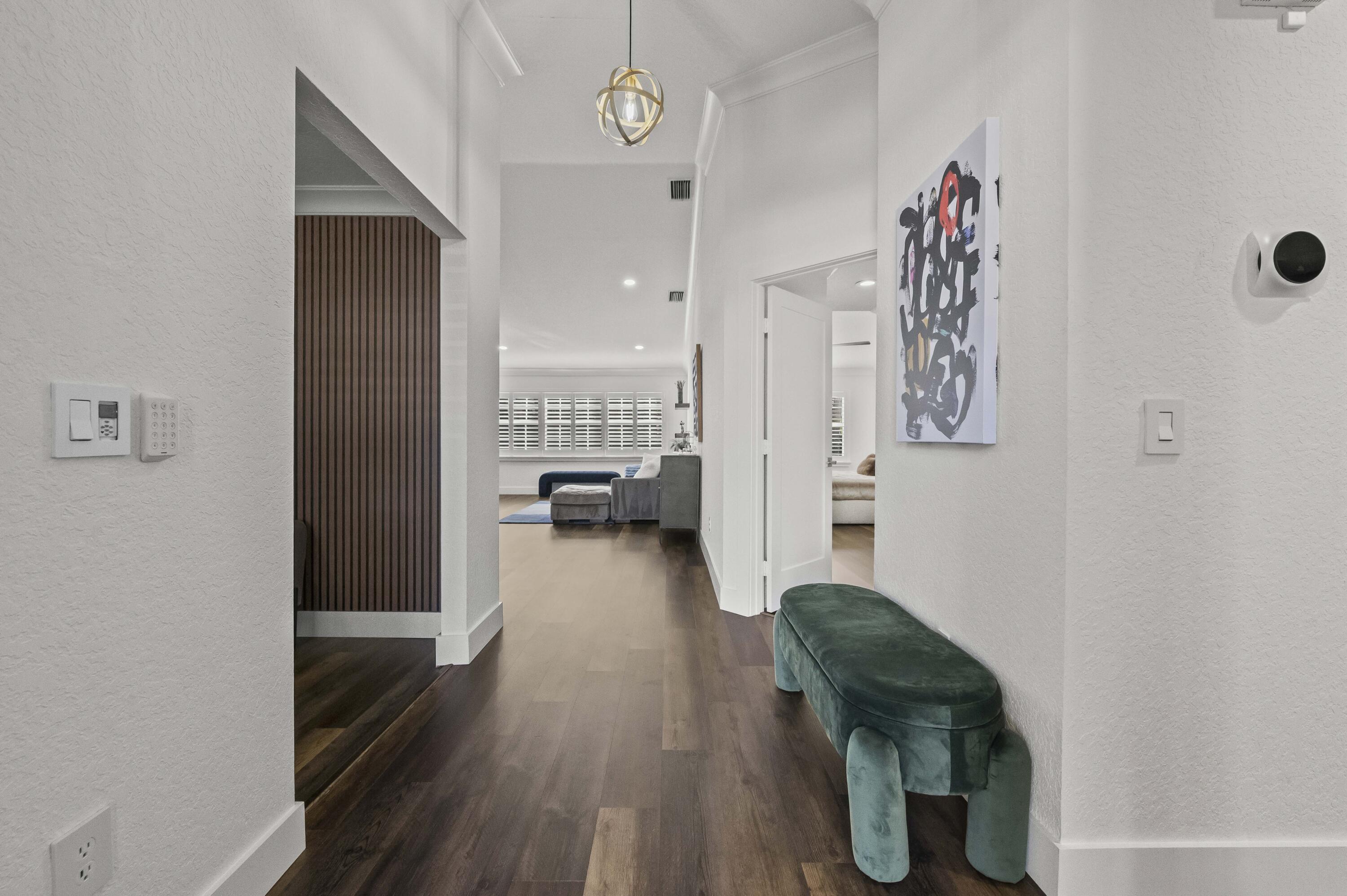 17257 Boca Club Boulevard, Unit 4 Boca Raton, FL 33487 - Photo 4 of 35 a living room with furniture and a wooden floor