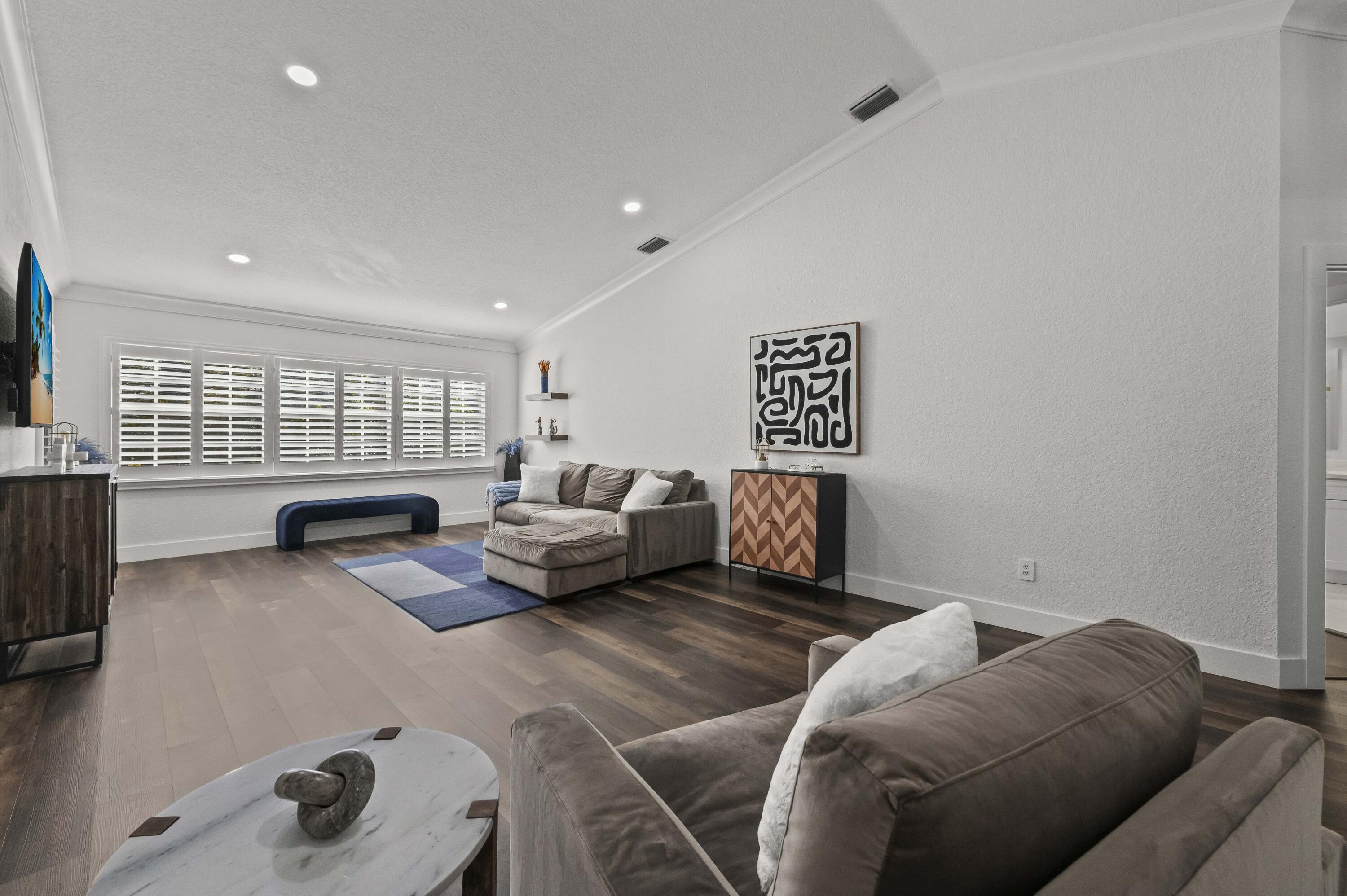 17257 Boca Club Boulevard, Unit 4 Boca Raton, FL 33487 - Photo 6 of 35 a bedroom with furniture and a window