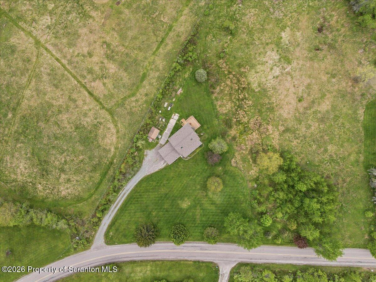 5231 Fiddle Lake Road Thompson, PA 18465 - Photo 5 of 34 a bird view of a yard