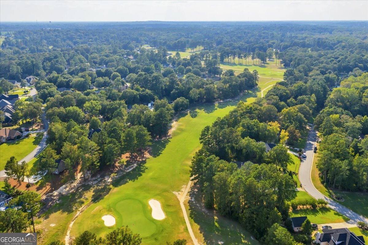 215 Falcon Crest Warner Robins, GA 31088 - Photo 12 of 18 a view of a lake with a building in the background