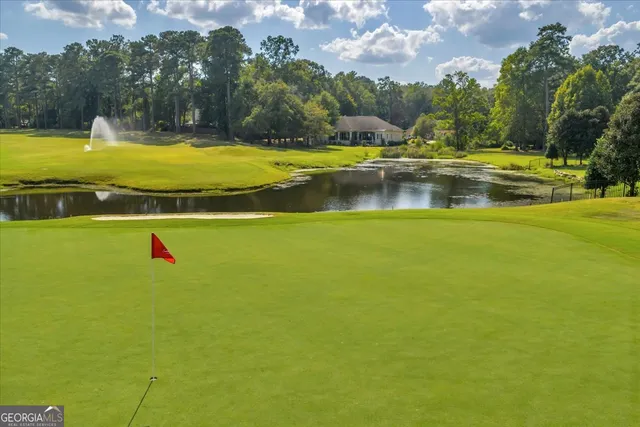 a view of a swimming pool with an outdoor space and seating area