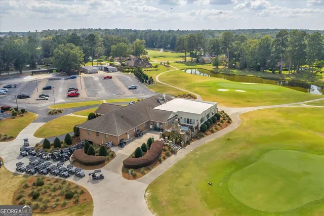 a view of a swimming pool with a yard