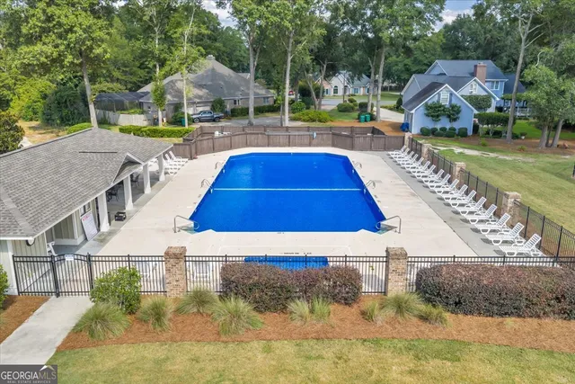 a view of an swimming pool with seating area