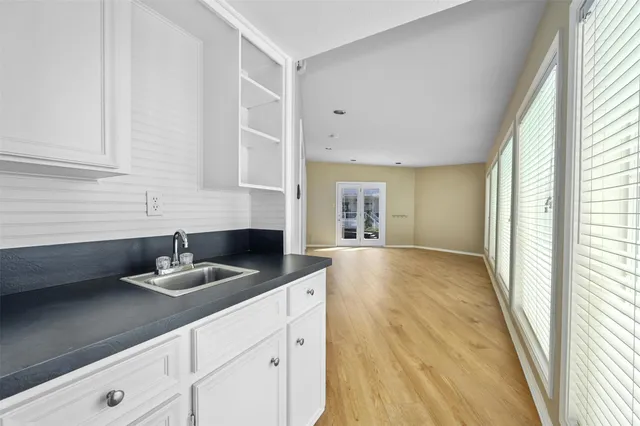 a kitchen with a sink and a window