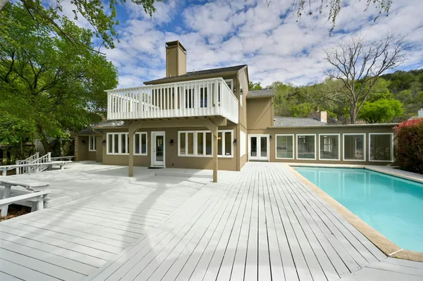 a view of balcony with wooden floor and outdoor space
