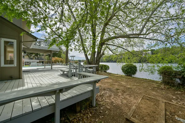 a view of a backyard with sitting area