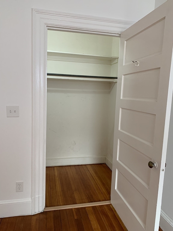 1064 Beacon Street, Unit 9 Brookline, MA 02446 - Photo 10 of 19 a view of walk in closet with empty racks