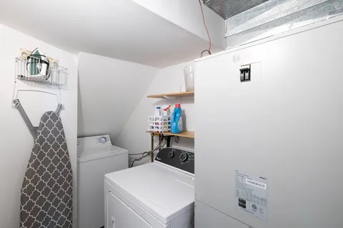 a balcony with wooden floor and outdoor seating
