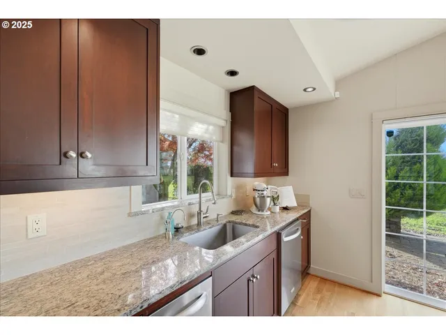 a kitchen with a sink and cabinets