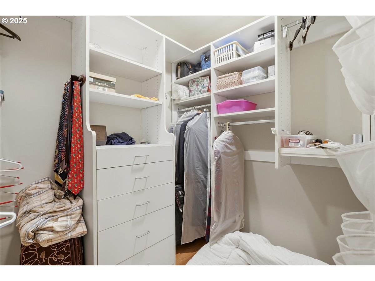 2365 Umpqua Road Woodburn, OR 97071 - Photo 23 of 33 a view of walk in closet with clothes and shoes