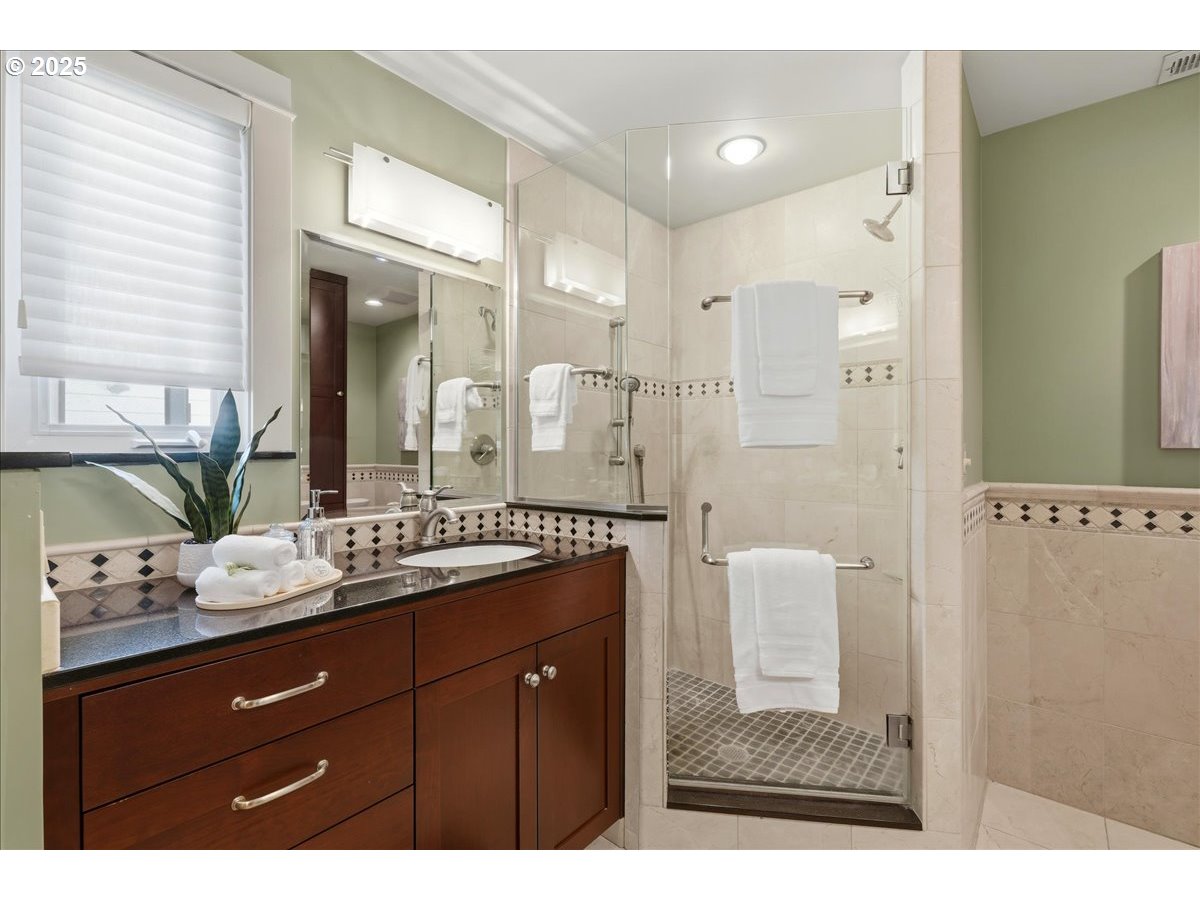 2365 Umpqua Road Woodburn, OR 97071 - Photo 26 of 33 a bathroom with a granite countertop sink mirror and shower
