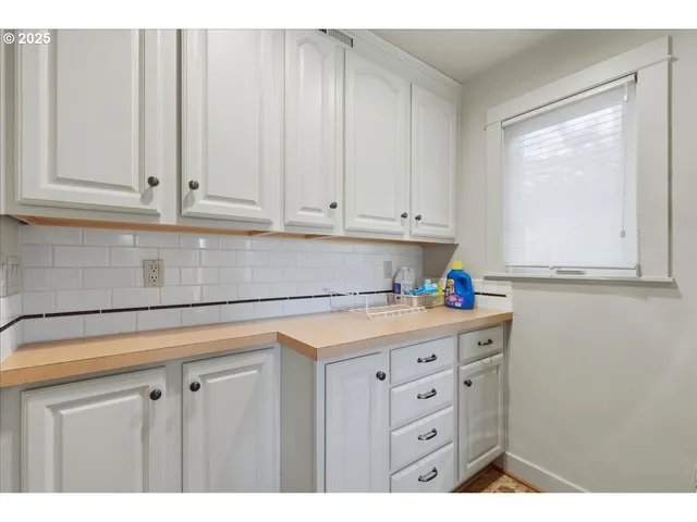 a room with cabinets and window