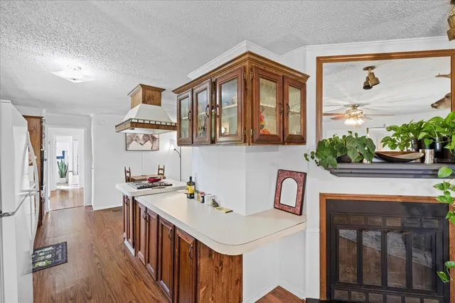 a utility room with a sink a window and appliances