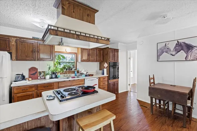 a kitchen with a table and chairs in it