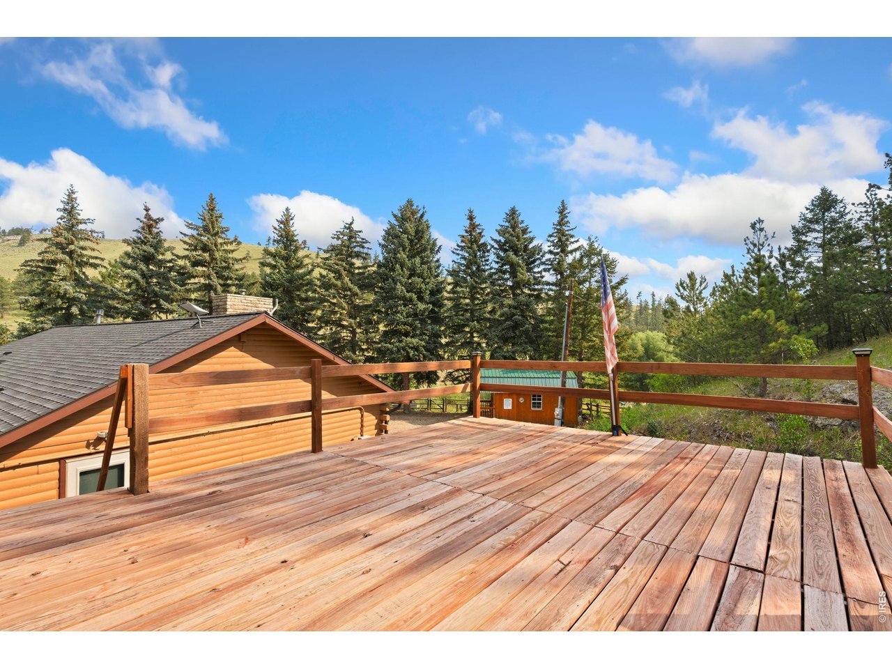 12743 Rist Canyon Road Bellvue, CO 80512 - Photo 31 of 49 a view of house with deck outdoor space and garden