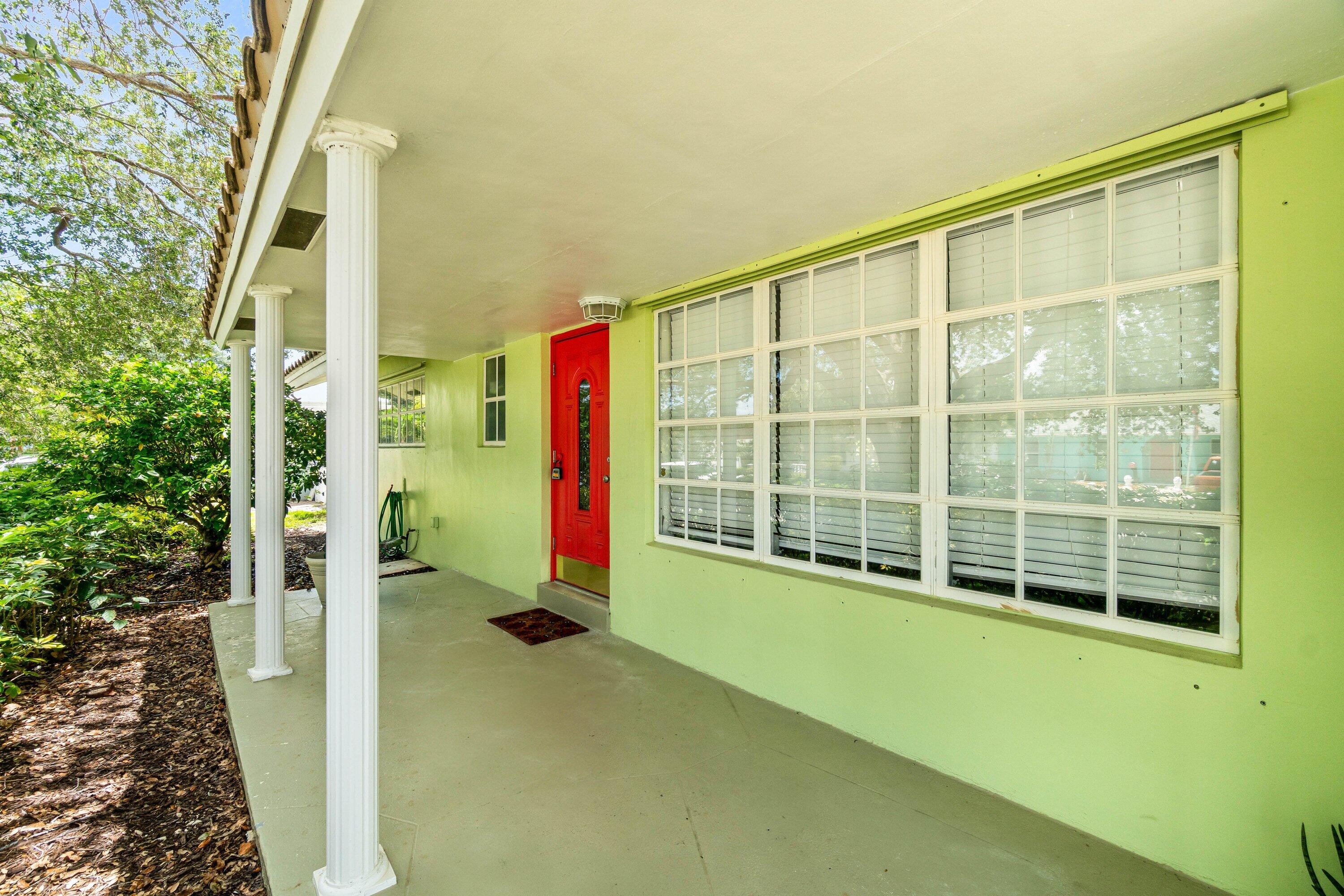 1290 Southwest 8th Street Boca Raton, FL 33486 - Photo 29 of 29 a view of an empty room with a floor to ceiling window and tree