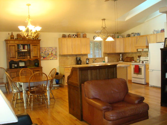 31 Madrona Road Miranda, CA 95553 - Photo 12 of 41 a kitchen with stainless steel appliances a table chairs and chandelier