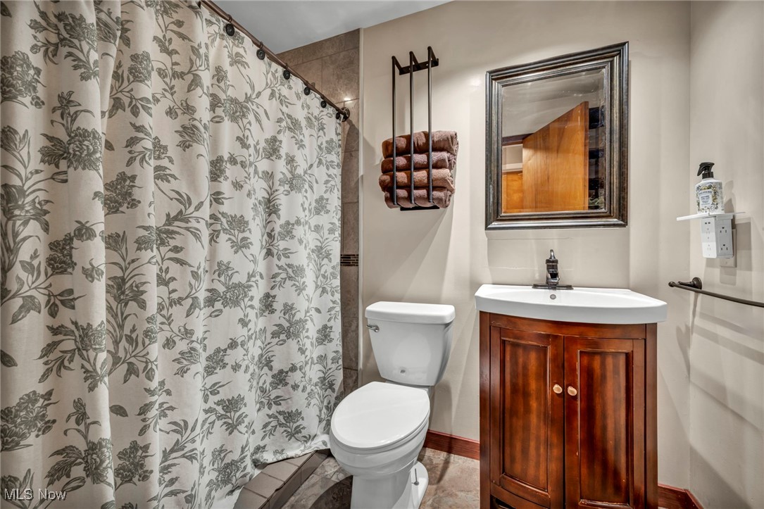 36462 Chestnut Ridge Road North Ridgeville, OH 44039 - Photo 26 of 47 Bathroom featuring vanity and curtained shower