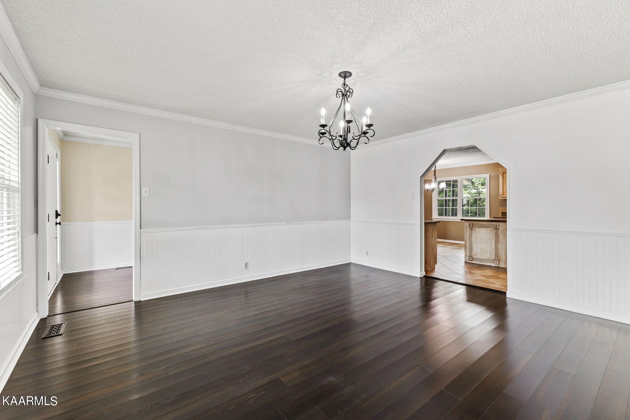 931 Pintail Road Knoxville, TN 37934 - Photo 13 of 51 an empty room with wooden floor chandelier and windows