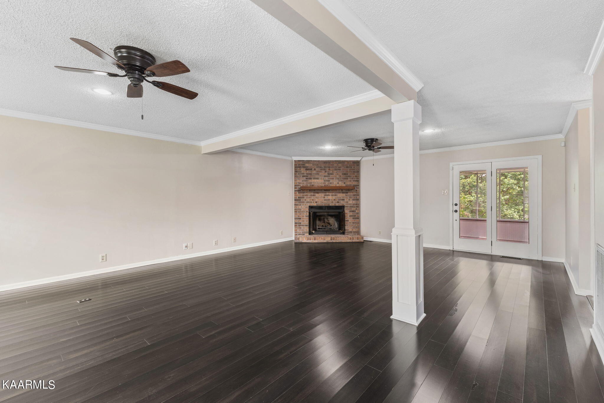 931 Pintail Road Knoxville, TN 37934 - Photo 6 of 51 an empty room with wooden floor chandelier and windows