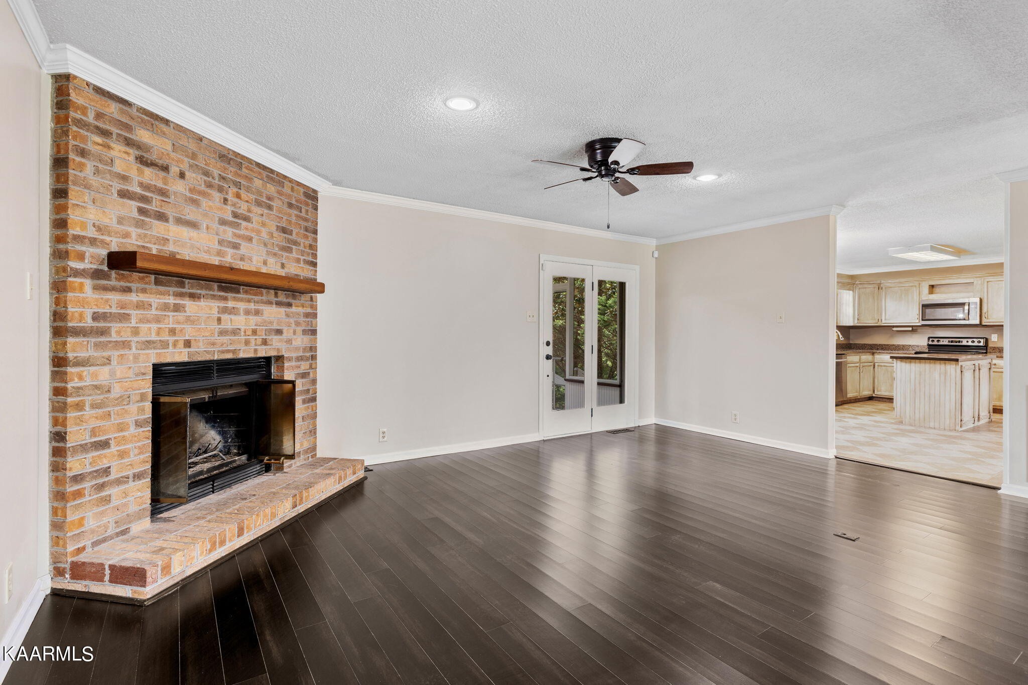 931 Pintail Road Knoxville, TN 37934 - Photo 7 of 51 a view of an empty room with a fireplace and a window