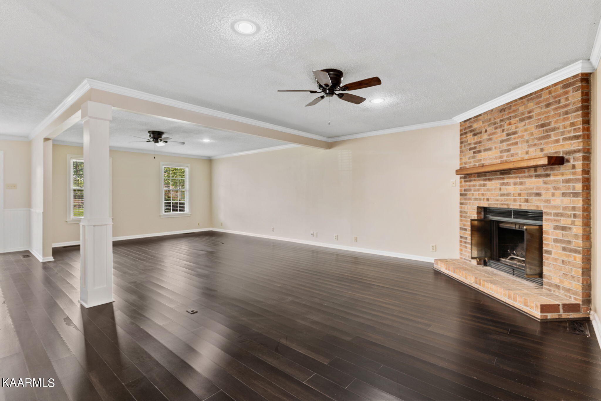 931 Pintail Road Knoxville, TN 37934 - Photo 9 of 51 a view of a livingroom with wooden floor a fireplace and windows