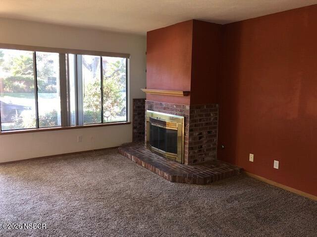 208 North R Street Lompoc, CA 93436 - Photo 11 of 22 an empty room with a fireplace