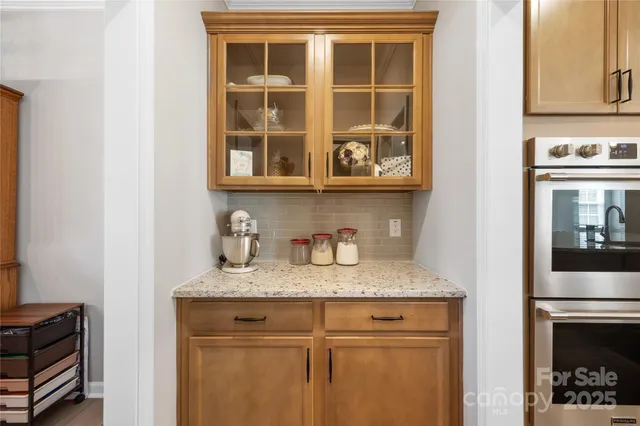 a kitchen with a sink and a refrigerator