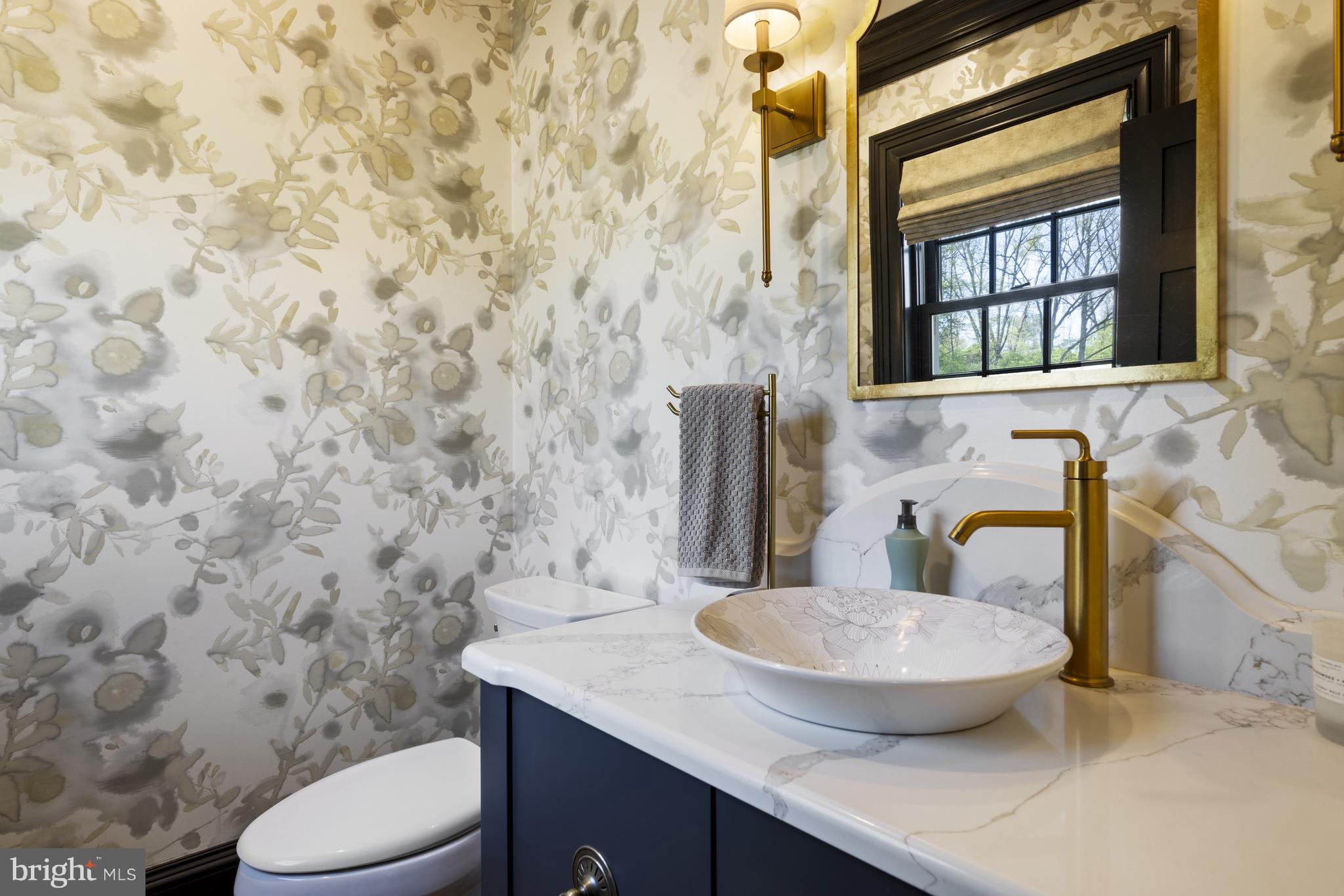 1250 Hillendale Road Chadds Ford, PA 19317 - Photo 20 of 76 a bathroom with a granite countertop toilet sink and mirror