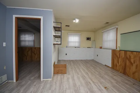 a view of kitchen and a wooden floor