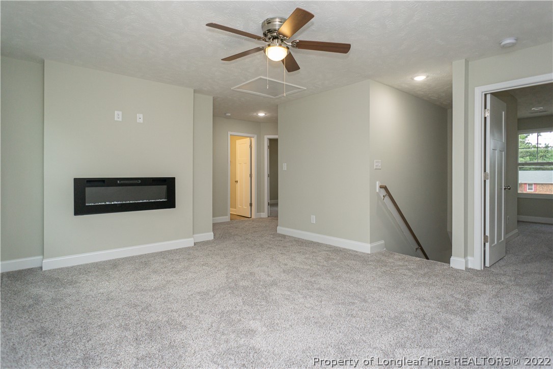 1628 Strickland Bridge Road Fayetteville, NC 28304 - Photo 17 of 34 a view of an empty room with a ceiling fan and window