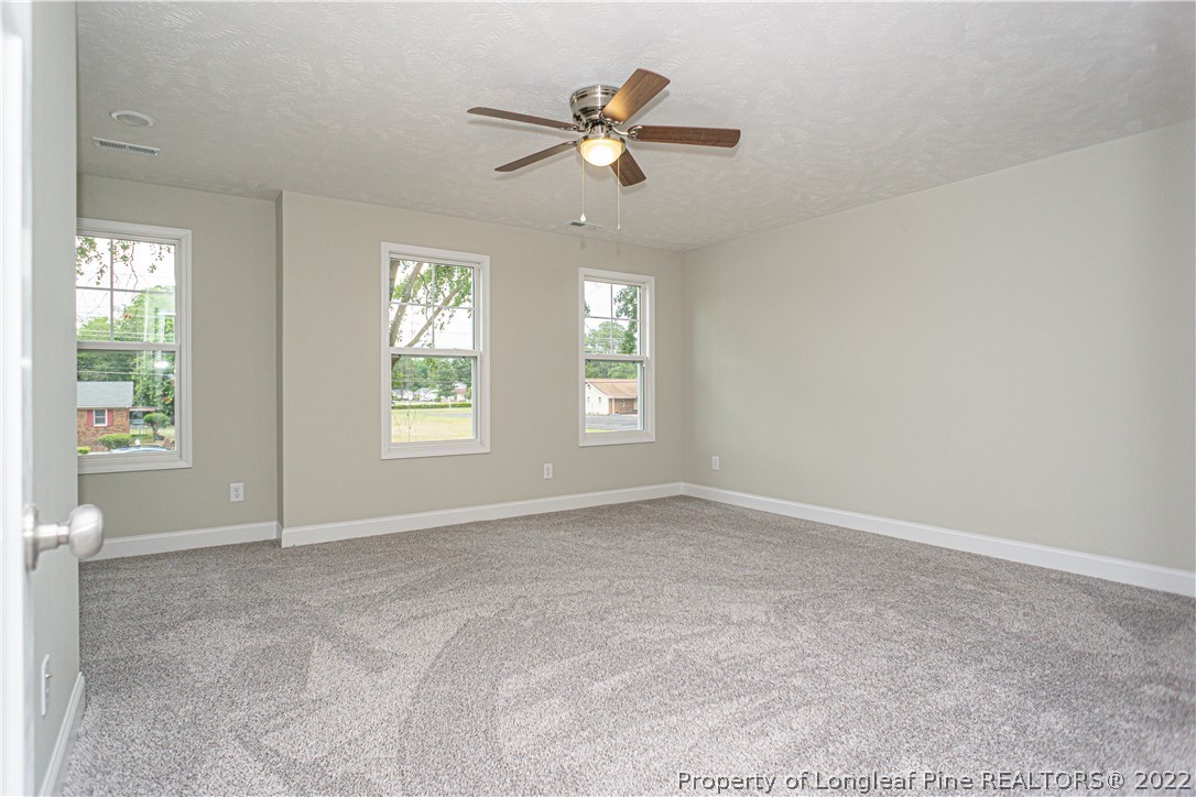 1628 Strickland Bridge Road Fayetteville, NC 28304 - Photo 19 of 34 a view of an empty room with a window